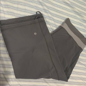 LULULEMON capri workout pants - grey size large with cross cross waistband